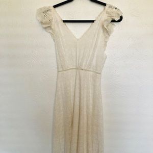 Long white lace dress.